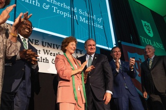 LaVeist, Weatherhead, Fitts, Mussafer and Forman applaud on stage