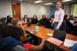 Charles Stoecker teaches in a full classroom