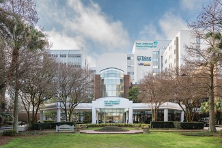East Jefferson General Hospital building with lawn and trees