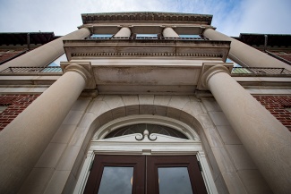 looking up at the door and columns of Newcomb Hall