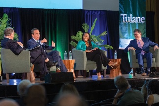 Gabe Feldman, Ashley Langford and Peter Ricchiuti on stage before an audience