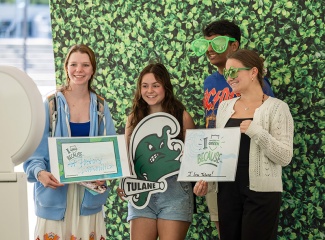 group of friends posing for photos during a Give Green event