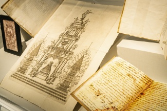 close up of historic documents in a museum case at the LAL Centennial Exhibit