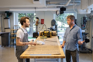 Jesse Toohey and Nick Perrin collaborate inside the expanded Fabrication Labs’ Woodshop