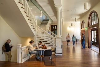 interior staircase and entrance of Richardson Memorial Hall with students