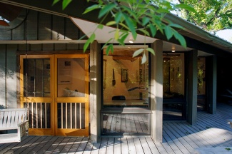 view of a building with gallery spaces in the woods