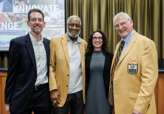 Pictured from left to right, Tulane Professor Scott Grayson, Pro Football Hall of Famer Bobby Bell, author Erin Grayson Sapp and Hall of Famer Ron Mix at a Tulane Center for Sport event.