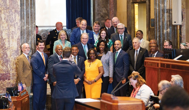 President Fitts stands with state Senate members and university leaders on the Louisiana Senate floor 