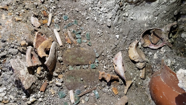 relics in excavation site of an ancient Maya tomb 