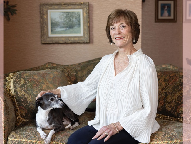 Celia Scott Weatherhead sits with her dog in her Ohio home