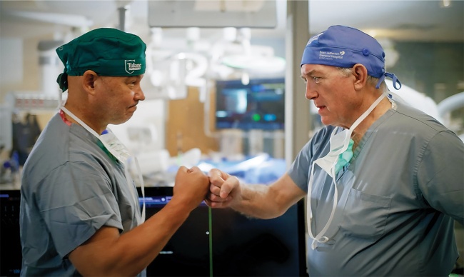 Dr. José Wiley and Dr. Harry Roach fist bump 