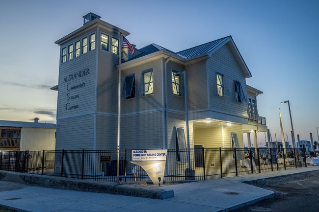 Sailing center building by the water at dusk