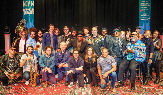 Diverse ensemble of musicians gathered on stage with Bill Murray.
